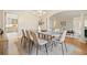 Elegant dining room featuring a modern table, chandelier, and seamless flow to the living area at 2938 Summitop Ne Rd, Marietta, GA 30066