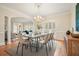Formal dining room featuring hardwood floors, chandelier, and ample seating at the dining table at 2938 Summitop Ne Rd, Marietta, GA 30066