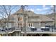 Well-maintained house exterior with a large deck, windows and backyard views at 2938 Summitop Ne Rd, Marietta, GA 30066