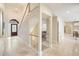 Grand foyer with a staircase, a chandelier, and elegant tile flooring creates a welcoming entrance at 2938 Summitop Ne Rd, Marietta, GA 30066