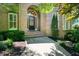 Inviting front entrance with a brick facade, a decorative front door, and manicured landscaping at 2938 Summitop Ne Rd, Marietta, GA 30066