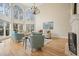 Bright living room boasts soaring ceilings, large arched windows, hardwood floors, and a cozy seating arrangement at 2938 Summitop Ne Rd, Marietta, GA 30066
