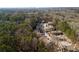 An aerial shot of the apartment complex with an abundance of trees and ample parking spaces at 707 Woodcliff Dr, Atlanta, GA 30350