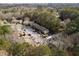 An aerial view showcasing the apartment complex, surrounded by lush greenery and ample parking at 707 Woodcliff Dr, Atlanta, GA 30350