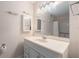 Bathroom featuring a large vanity, decorative mirror, and shower-tub combination at 707 Woodcliff Dr, Atlanta, GA 30350