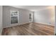 Spacious bedroom with wood-look floors and two windows providing ample natural light at 707 Woodcliff Dr, Atlanta, GA 30350