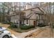 Inviting condo building featuring a well-kept exterior, second story balconies, and ample parking at 707 Woodcliff Dr, Atlanta, GA 30350