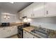 Updated kitchen featuring granite countertops and stainless steel appliances with natural light at 707 Woodcliff Dr, Atlanta, GA 30350