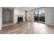 Bright living room featuring a fireplace, built-in shelves, and sliding glass doors to the outside at 707 Woodcliff Dr, Atlanta, GA 30350