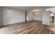 Bright and airy living room with modern flooring, decorative lighting, and a cozy fireplace at 707 Woodcliff Dr, Atlanta, GA 30350