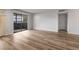 Spacious living room featuring new floors, sliding glass doors, and a cozy fireplace at 707 Woodcliff Dr, Atlanta, GA 30350