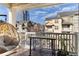 Inviting balcony with outdoor seating, wood-look tile flooring, and neighborhood views at 142 Perimeter Walk, Atlanta, GA 30338