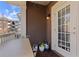 Cozy balcony featuring string lights, exterior lighting fixture, and wood-look tile flooring at 142 Perimeter Walk, Atlanta, GA 30338