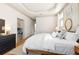 Bright and airy bedroom with hardwood floors, tray ceiling, and white walls at 142 Perimeter Walk, Atlanta, GA 30338