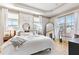Bright and airy bedroom with hardwood floors, tray ceiling, and white walls at 142 Perimeter Walk, Atlanta, GA 30338