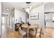 Cozy dining area with modern light fixture, hardwood floors, and neutral decor at 142 Perimeter Walk, Atlanta, GA 30338
