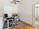 Home office with hardwood floors and a desk, chair and monitor for the new home owner at 142 Perimeter Walk, Atlanta, GA 30338