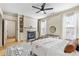 Inviting main bedroom with fireplace, built-ins, and windows at 142 Perimeter Walk, Atlanta, GA 30338