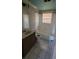 A cozy bathroom featuring a wooden vanity, standard toilet, and a shower-tub combo at 2224 Elizabeth Se Ave, Smyrna, GA 30080