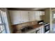 This cozy kitchen features tiled countertops, ample cabinet space, and essential appliances at 2224 Elizabeth Se Ave, Smyrna, GA 30080