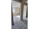 An open-concept living area with tile flooring and ample natural light at 2224 Elizabeth Se Ave, Smyrna, GA 30080