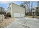 This home features a 2-car garage, a basketball hoop, and a driveway with an additional parking area at 2540 Alberta Ln, Marietta, GA 30062