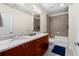 Bathroom featuring double vanity, granite countertop and shower-tub combination at 400 W Peachtree Nw St # 3204, Atlanta, GA 30308
