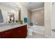 Bright bathroom features granite counters, cherry vanity and a shower over the tub at 400 W Peachtree Nw St # 3204, Atlanta, GA 30308