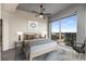 Cozy bedroom featuring a ceiling fan, large windows with city views, and stylish decor at 400 W Peachtree Nw St # 3204, Atlanta, GA 30308