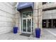 Inviting building entrance with manicured plants, showcasing a modern design and prime location at 400 W Peachtree Nw St # 3204, Atlanta, GA 30308