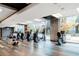 Well-lit gym with modern exercise equipment and large windows overlooking greenery at 400 W Peachtree Nw St # 3204, Atlanta, GA 30308
