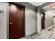 Hallway featuring unit door and carpet at 400 W Peachtree Nw St # 3204, Atlanta, GA 30308