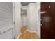 Hallway with wood floors featuring closet doors, and entry doors at 400 W Peachtree Nw St # 3204, Atlanta, GA 30308