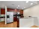 Kitchen featuring stainless steel appliances, wooden cabinets, and granite countertops at 400 W Peachtree Nw St # 3204, Atlanta, GA 30308