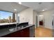 Modern kitchen featuring stainless steel appliances, granite countertops, and large windows with city views at 400 W Peachtree Nw St # 3204, Atlanta, GA 30308