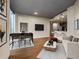 Contemporary living space with dining area, sleek furniture, hardwood floors, and modern kitchen at 400 W Peachtree Nw St # 3204, Atlanta, GA 30308
