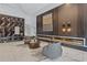 Modern lobby with stylish seating, geometric wall art, and a linear fireplace feature at 400 W Peachtree Nw St # 3204, Atlanta, GA 30308