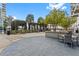 Outdoor patio with seating, greenery, and views of the building's exterior at 400 W Peachtree Nw St # 3204, Atlanta, GA 30308