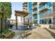 Outdoor patio with pergola, seating areas, and views of the surrounding cityscape at 400 W Peachtree Nw St # 3204, Atlanta, GA 30308
