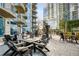 Outdoor patio with dining tables, offering a relaxing space with views of the high-rise building at 400 W Peachtree Nw St # 3204, Atlanta, GA 30308