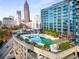 Beautiful rooftop pool with landscaped surrounding and skyline views in a modern building at 400 W Peachtree Nw St # 3204, Atlanta, GA 30308