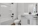 Full bathroom with a shower-tub combo and modern fixtures, featuring white cabinetry at 911 Echo Park Dr, Suwanee, GA 30024