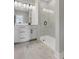 Modern bathroom featuring a glass shower and double sink vanity with tile flooring at 911 Echo Park Dr, Suwanee, GA 30024