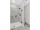 Walk-in shower with glass doors and dark hardware at 911 Echo Park Dr, Suwanee, GA 30024