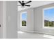 Bright bedroom with neutral walls, carpet floors, and two large windows at 911 Echo Park Dr, Suwanee, GA 30024