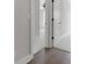 Bedroom view showing a doorway with hardwood flooring and carpeted floors beyond at 911 Echo Park Dr, Suwanee, GA 30024