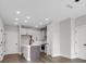 Contemporary kitchen featuring an island, stainless steel appliances, and ample cabinet space at 911 Echo Park Dr, Suwanee, GA 30024