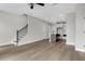 Bright and airy living space with hardwood floors and open layout to kitchen at 911 Echo Park Dr, Suwanee, GA 30024