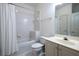 Bright bathroom featuring a shower-tub combination, toilet, and vanity with a mirror at 1605 Ridenour Nw Pkwy, Kennesaw, GA 30152