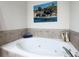 Bright bathroom features a relaxing soaking tub and modern fixtures at 1605 Ridenour Nw Pkwy, Kennesaw, GA 30152